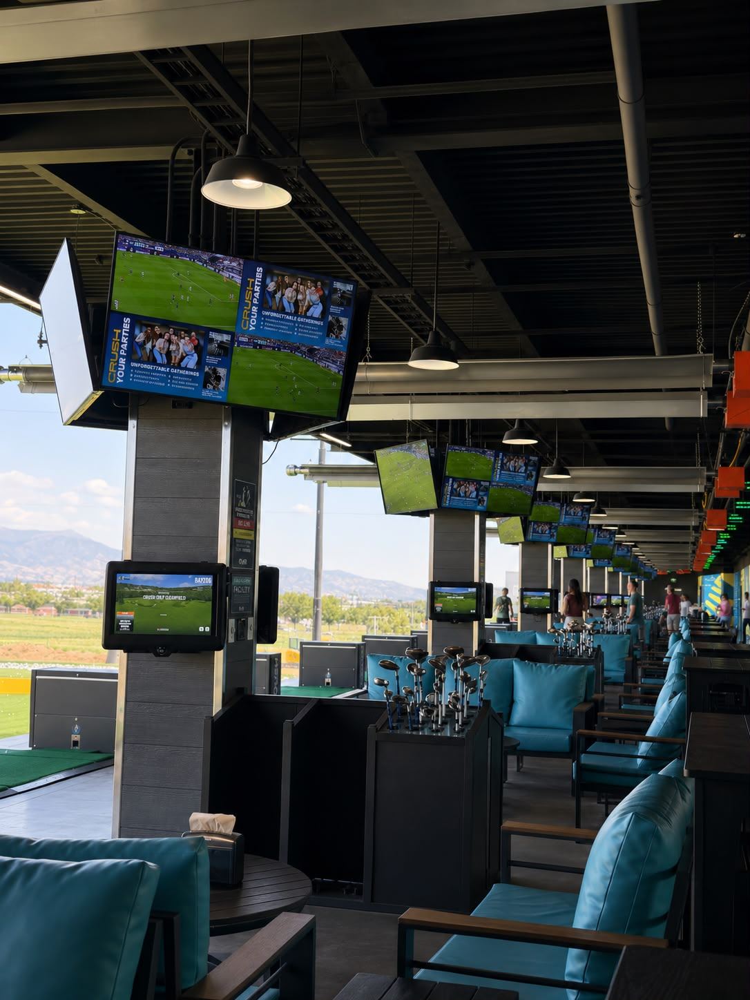 Crush Golf & Grill guest bays with lounge seating and displays